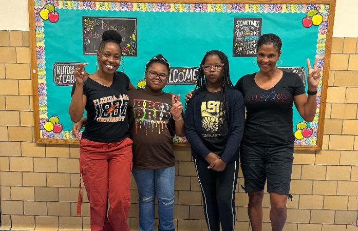  two students and two staff members celebrating HBCU week